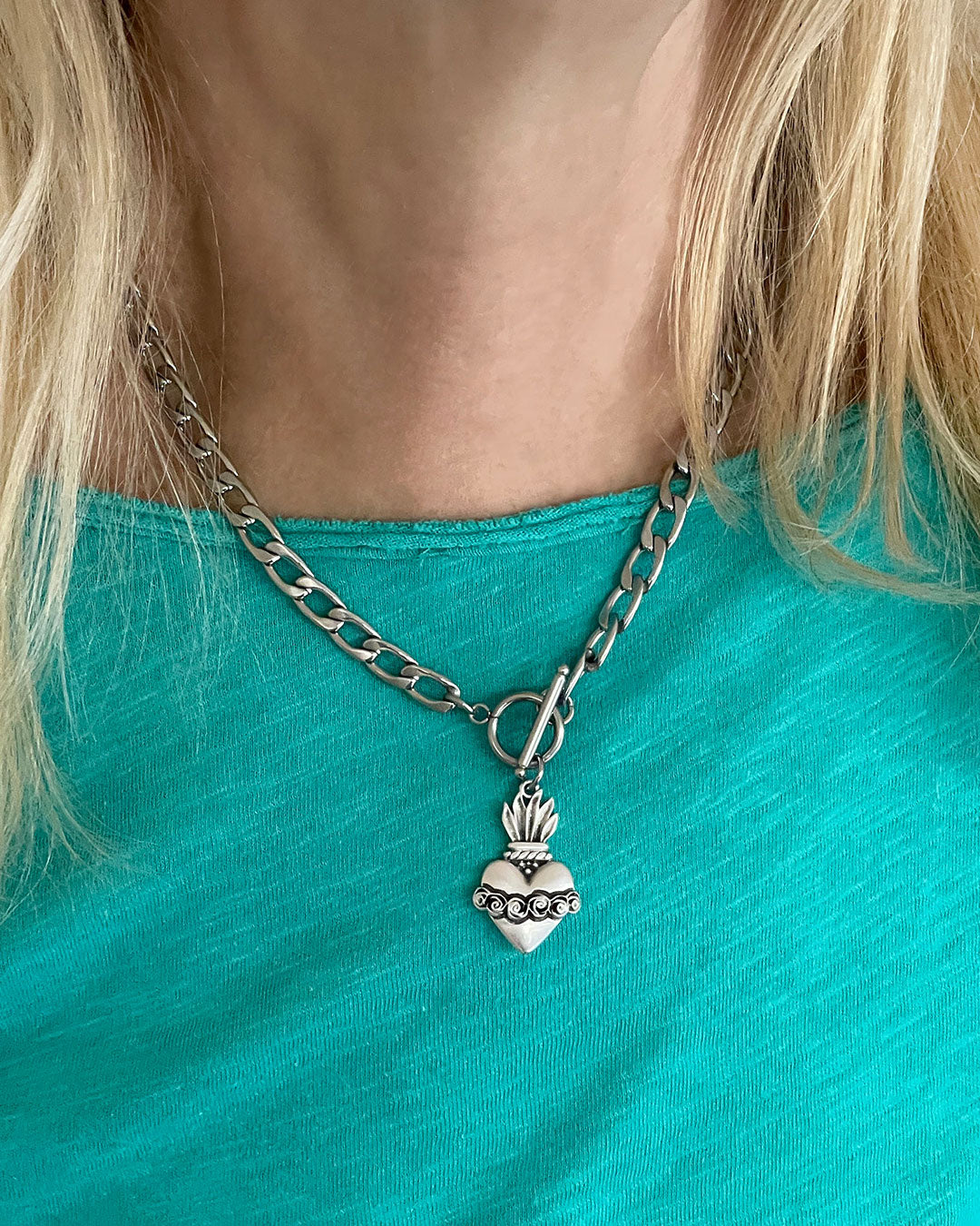 Model wearing a Sacred Heart Toggle Necklace in silver