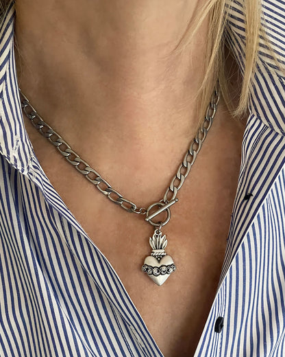 Model wearing a Sacred Heart Toggle Necklace in silver