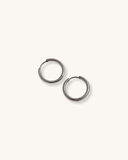 Pair of silver hoop earrings 14mm on a white background 