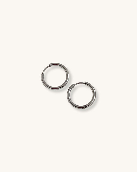 Pair of silver hoop earrings 14mm on a white background 