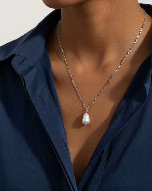 Model wearing a single pearl necklace in silver