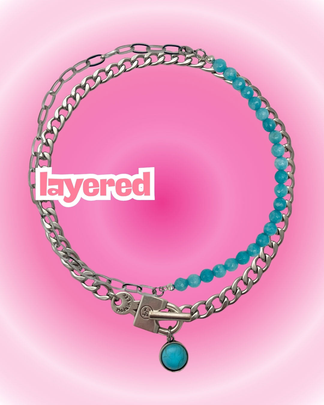 Two layered bracelets with turquoise beads and a silver chain on a pink background.