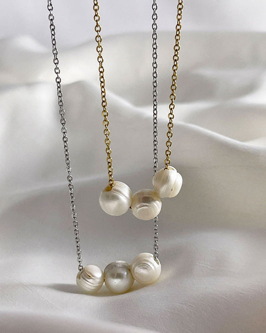 Two dainty chain necklaces with three pearls in gold and silver 