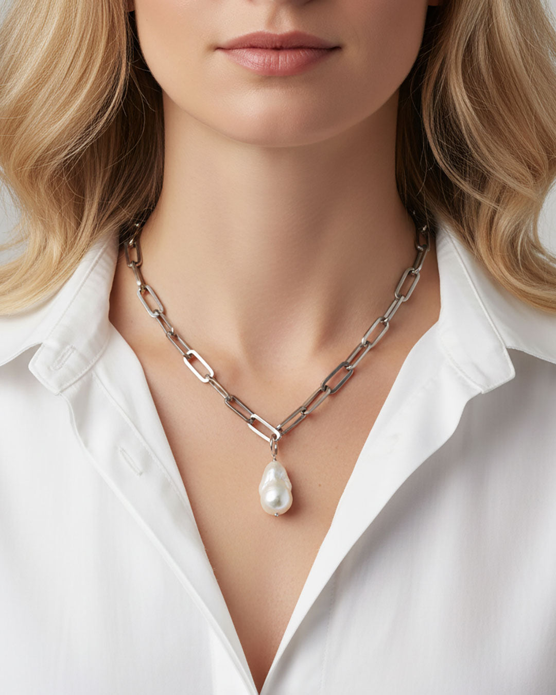 Model wearing a baroque pearl paperclip chain necklace in silver