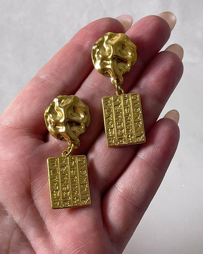 Gold dangle earrings Egyptian style wth hieroglyphic tags