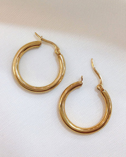 The 25mm Gold Hoop Earrings, a pair of stainless steel hoops in gold