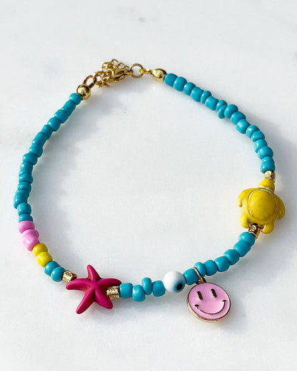 A Pink Smiley Sea Turtle Beaded Anklet