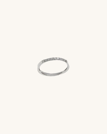 A waterproof silver band ring in white crystal