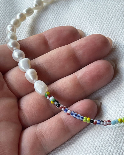 The Venetia Necklace is a half colorful beads and half pearls beaded necklace perfect for layering