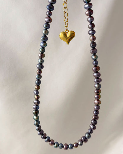 black pearl necklace in peacock overtone