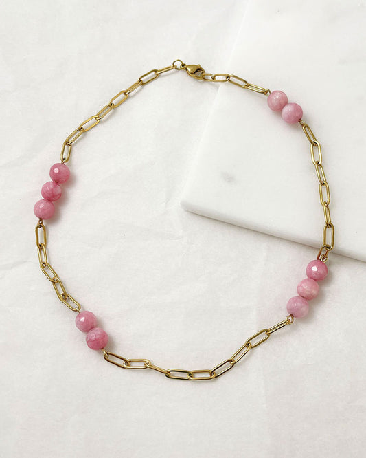 A pink agate statement necklace with a gold paperclip chain