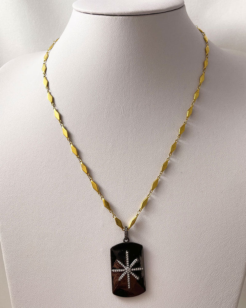 A trendy Star Tag Necklace with a touch of sparkle