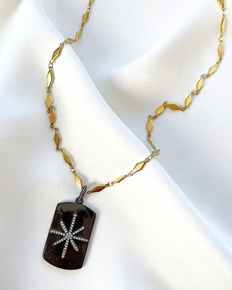 A trendy Star Tag Necklace with a touch of sparkle