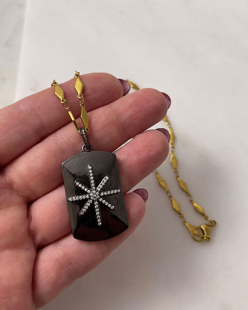 A trendy Star Tag Necklace with a touch of sparkle