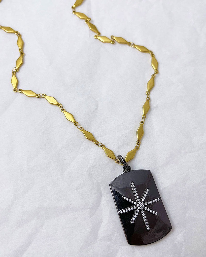 A trendy Star Tag Necklace with a touch of sparkle