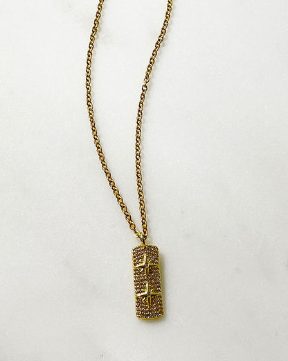 A pave stars tag charm on a dainty chain in gold